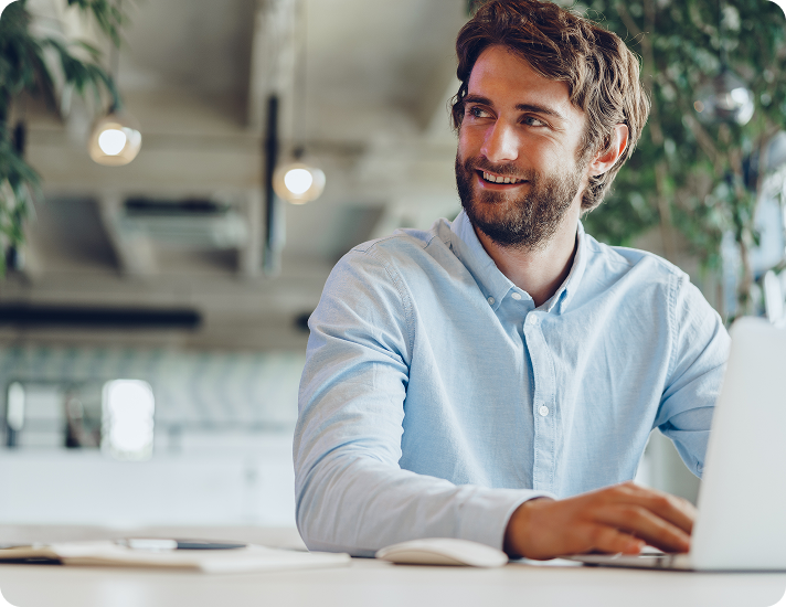 person-smiling-at-laptop-landscape